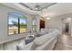 Bright living room featuring stylish furniture, wood floors, and large windows providing ample natural light at 8123 Wawana Rd, North Port, FL 34287
