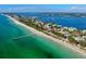 Breathtaking aerial view of the shore and beach homes near the clear turquoise water at 8420 43Rd Avenue W Dr, Bradenton, FL 34209