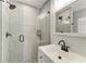 Modern bathroom with a glass-enclosed shower, a vanity, and stylish fixtures at 8420 43Rd Avenue W Dr, Bradenton, FL 34209