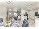 Open concept dining area with views of the living room and kitchen at 8420 43Rd Avenue W Dr, Bradenton, FL 34209