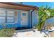 Close-up of the front door featuring glass insets surrounded by white rock landscaping at 8420 43Rd Avenue W Dr, Bradenton, FL 34209