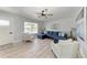 Cozy living room with laminate floors and an inviting seating arrangement and front entry at 8420 43Rd Avenue W Dr, Bradenton, FL 34209