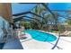 Inviting screened-in pool area with patio seating, perfect for outdoor living and entertaining at 8420 43Rd Avenue W Dr, Bradenton, FL 34209