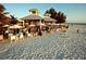 Beachfront restaurant with outdoor seating, white umbrellas, and gorgeous views of the ocean at 8420 43Rd Avenue W Dr, Bradenton, FL 34209
