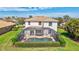 Aerial shot of house with screened-in pool, mature landscaping, and tile roof; well-maintained property at 8603 River Preserve Dr, Bradenton, FL 34212