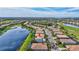 Beautiful aerial view of a residential community with lake and golf course views, featuring single-Gathering homes at 8603 River Preserve Dr, Bradenton, FL 34212