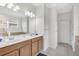 Luxurious bathroom with double vanity, a soaking tub, a tiled shower, and modern fixtures at 8603 River Preserve Dr, Bradenton, FL 34212