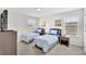 Inviting bedroom with two twin beds, matching nightstands, and ample natural light from two windows at 8603 River Preserve Dr, Bradenton, FL 34212