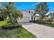 Beautiful single Gathering home featuring a brick driveway and lush landscaping at 8603 River Preserve Dr, Bradenton, FL 34212