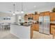 Spacious kitchen with granite counters, stainless appliances, and dining area at 8603 River Preserve Dr, Bradenton, FL 34212
