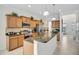 Well-lit kitchen featuring wood cabinets, granite countertops, and stainless steel appliances at 8603 River Preserve Dr, Bradenton, FL 34212