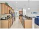 Open concept kitchen featuring granite countertops and stainless steel appliances at 8603 River Preserve Dr, Bradenton, FL 34212