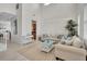 Bright living room featuring high ceilings, stylish decor and plenty of natural light at 8603 River Preserve Dr, Bradenton, FL 34212