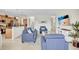 Spacious living room with an open concept to the kitchen and ample seating at 8603 River Preserve Dr, Bradenton, FL 34212