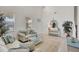 Bright living room featuring high ceilings, coastal decor and plenty of natural light at 8603 River Preserve Dr, Bradenton, FL 34212
