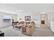 Bright living room featuring neutral tones, comfortable seating, a decorative coffee table, and natural light at 8603 River Preserve Dr, Bradenton, FL 34212
