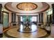 Grand lobby features ornate chandelier, decorative columns, and elegant seating at the River Strand clubhouse at 8603 River Preserve Dr, Bradenton, FL 34212