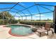 Relaxing screened-in pool and spa area with comfortable lounge chairs, perfect for enjoying outdoor leisure at 8603 River Preserve Dr, Bradenton, FL 34212