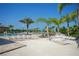 Inviting pool area with clear blue water, palm trees, hammocks and lounge chairs for relaxation at 8603 River Preserve Dr, Bradenton, FL 34212
