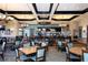 Spacious restaurant featuring modern decor, stylish lighting, and a fully stocked bar area for an upscale dining experience at 8603 River Preserve Dr, Bradenton, FL 34212