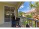 Balcony view overlooking the neighborhood and trees, providing a serene outdoor space at 927 River Basin Ct # 201C, Bradenton, FL 34212