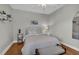 This bedroom features hardwood floors, neutral colors, and modern ceiling fan at 927 River Basin Ct # 201C, Bradenton, FL 34212