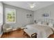 This bedroom features natural light, hardwood floors, and neutral colors at 927 River Basin Ct # 201C, Bradenton, FL 34212