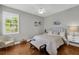 This bedroom features natural light, hardwood floors, and neutral colors at 927 River Basin Ct # 201C, Bradenton, FL 34212