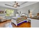 Bright bedroom with hardwood floors, tray ceilings and decorative lighting at 927 River Basin Ct # 201C, Bradenton, FL 34212