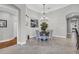 Elegant dining room with a stylish chandelier and access to the kitchen at 927 River Basin Ct # 201C, Bradenton, FL 34212