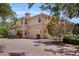 Exterior view showcasing a multi-car driveway and a well-maintained home with a red tile roof at 927 River Basin Ct # 201C, Bradenton, FL 34212