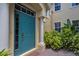 Inviting front door with decorative windows surrounded by lush landscaping at 927 River Basin Ct # 201C, Bradenton, FL 34212