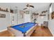 Game room featuring a pool table, exercise bike, and unique wall decor at 927 River Basin Ct # 201C, Bradenton, FL 34212