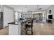 Modern kitchen with an island, pendant lighting, and seamless transition to the outdoor patio at 927 River Basin Ct # 201C, Bradenton, FL 34212