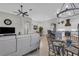 Open-concept living room with a kitchen island, dining area, and comfortable seating at 927 River Basin Ct # 201C, Bradenton, FL 34212