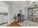 Well-lit home office with modern ceiling fan and convenient laundry room access at 927 River Basin Ct # 201C, Bradenton, FL 34212