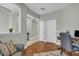 Well-lit home office with neutral paint, wood floors, and comfortable seating at 927 River Basin Ct # 201C, Bradenton, FL 34212
