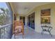 Covered patio area with outdoor seating and sliding glass doors, merging indoor and outdoor living spaces seamlessly at 927 River Basin Ct # 201C, Bradenton, FL 34212
