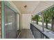 Covered balcony provides a serene outdoor space with scenic views of lush greenery at 928 Sunridge Dr # F2, Sarasota, FL 34234