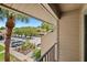 Balcony featuring a view of the community parking and landscaping at 928 Sunridge Dr # F2, Sarasota, FL 34234