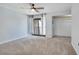 Bedroom with a ceiling fan, closet and access to a balcony at 928 Sunridge Dr # F2, Sarasota, FL 34234