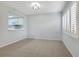 Empty dining room featuring tiled floor, light grey walls, and window shutters at 928 Sunridge Dr # F2, Sarasota, FL 34234