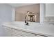 Bright kitchen featuring white cabinetry and a modern gooseneck faucet at 928 Sunridge Dr # F2, Sarasota, FL 34234