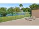 Relaxing patio featuring lounge chairs with tranquil views of the pond and fountain at 928 Sunridge Dr # F2, Sarasota, FL 34234