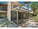 Exterior view of a screened porch, perfect for enjoying the outdoors and relaxing in the shade at 928 Sunridge Dr # F2, Sarasota, FL 34234
