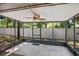 Enclosed porch with a ceiling fan, metal frames and providing an ideal spot for relaxation at 928 Sunridge Dr # F2, Sarasota, FL 34234
