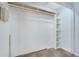 Bright walk-in closet with built-in shelving and carpet flooring offering efficient storage solutions at 928 Sunridge Dr # F2, Sarasota, FL 34234