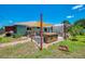 Backyard featuring hot tub and covered patio with seating for six, barbecue, and well maintained lawn at 9321 New Martinsville Ave, Englewood, FL 34224