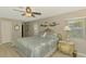 Relaxing bedroom with a decorated bed, a window letting in natural light, and matching bedside tables at 9321 New Martinsville Ave, Englewood, FL 34224