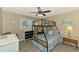 Charming bedroom featuring bunk beds and matching dressers with ocean-themed decor at 9321 New Martinsville Ave, Englewood, FL 34224